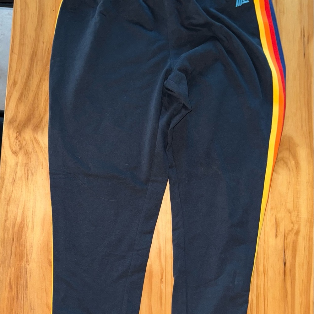 Women’s Aldi Navy Blue Joggers with red, yellow and orange stripes NWT